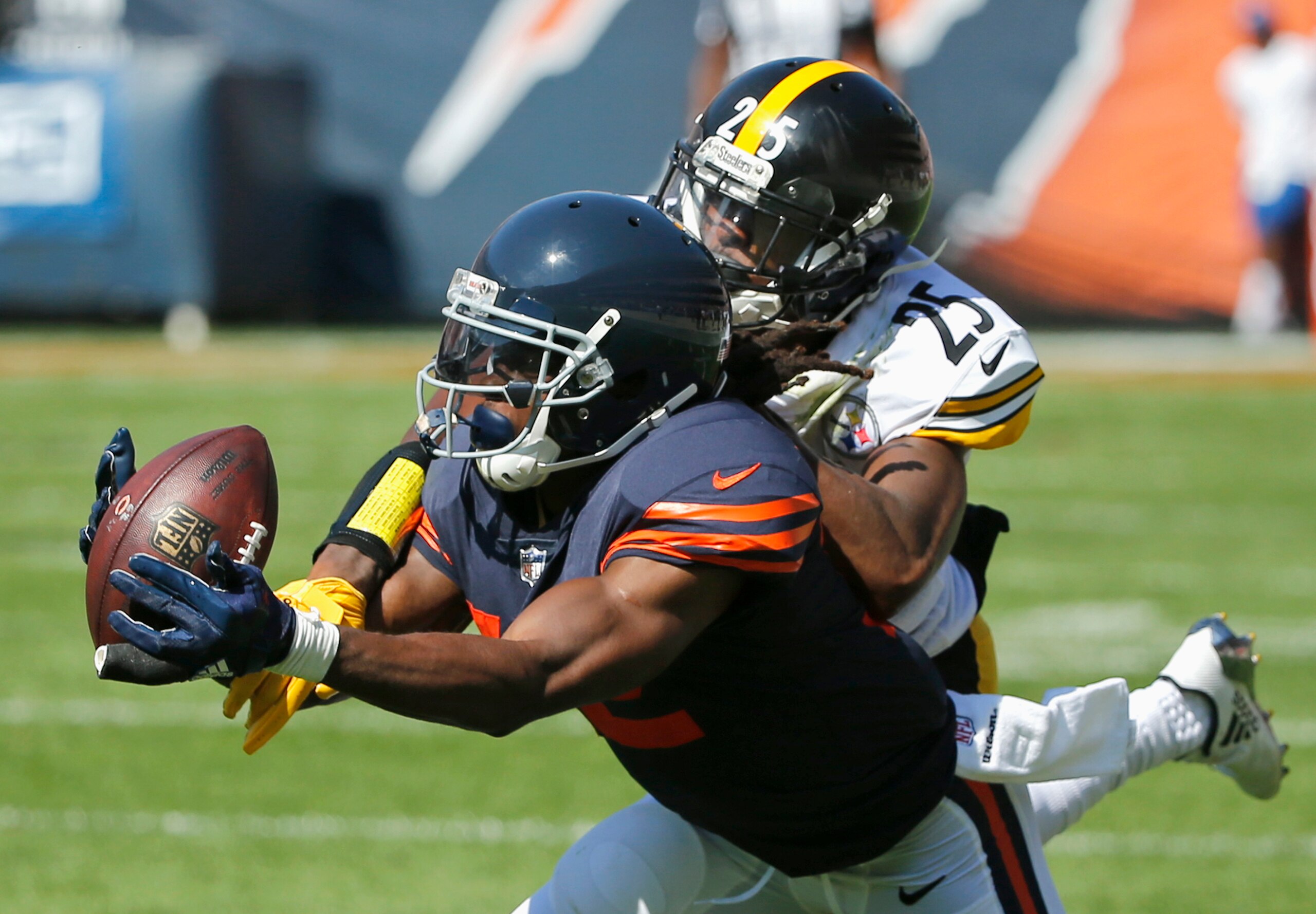 Pittsburgh Steelers cornerback Artie Burns (25) breaks up a pass intended for Chicago Bears wide receiver Markus Wheaton (12) during the first half of an NFL football game, Sunday, Sept. 24, 2017, in Chicago. (AP Photo/Charles Rex Arbogast)