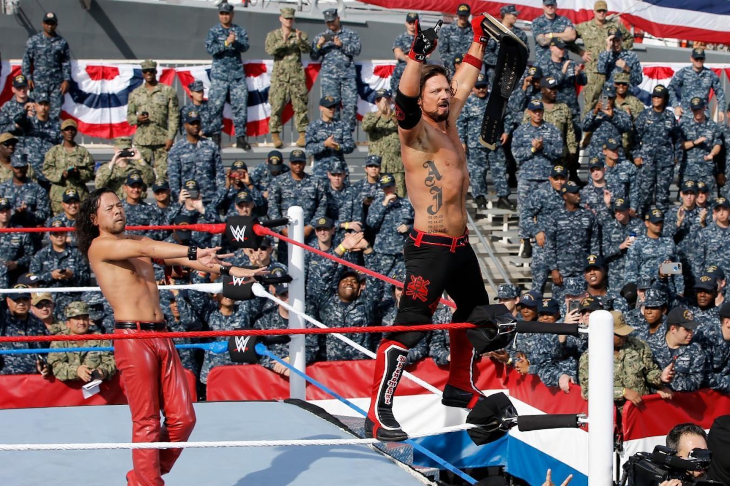 AJ Styles and Shinsuke Nakamura celebrating a win at Tribute to the Troops.