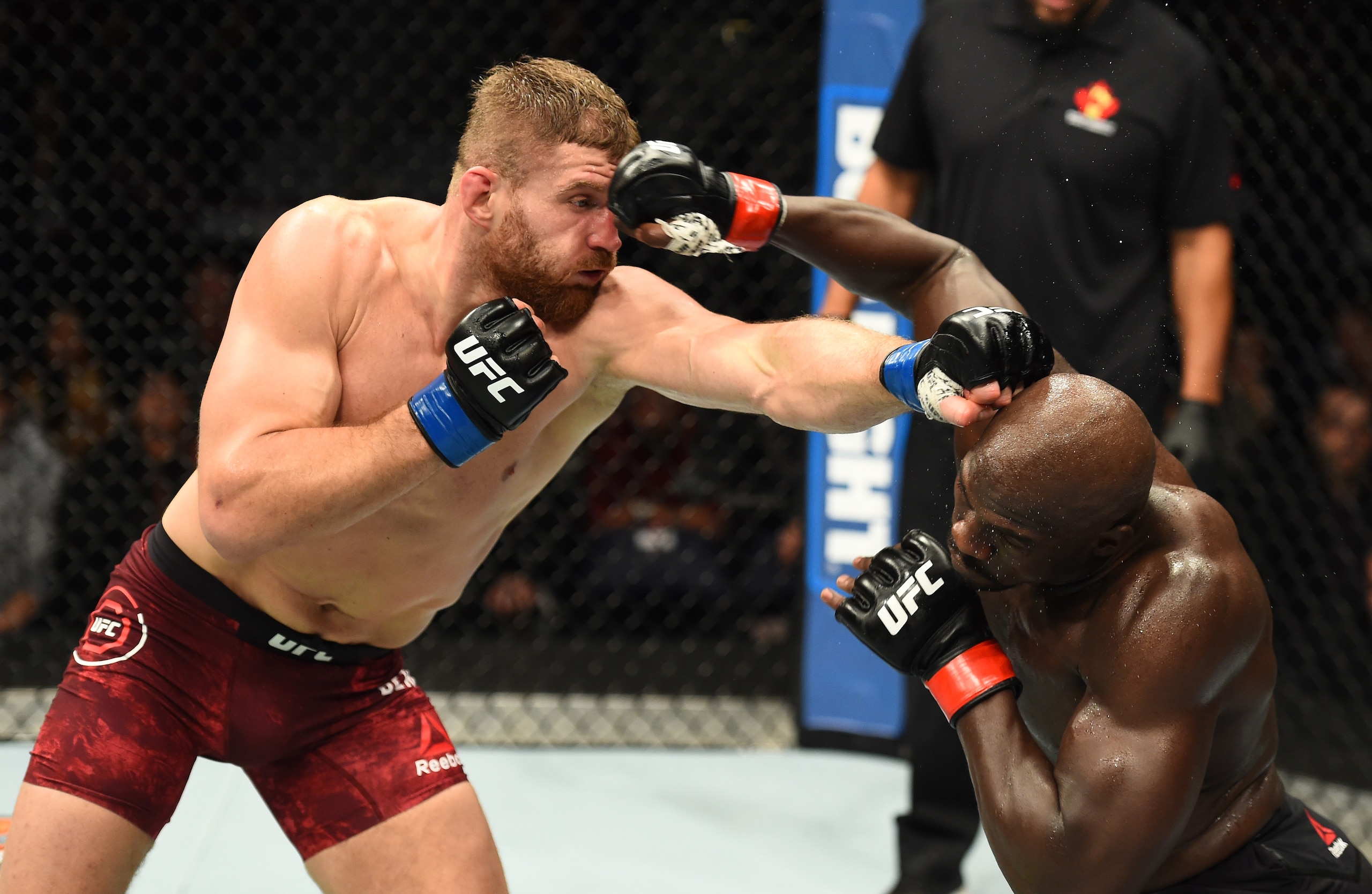 Jared Cannonier (right) exchanges with Jan Blachowicz.