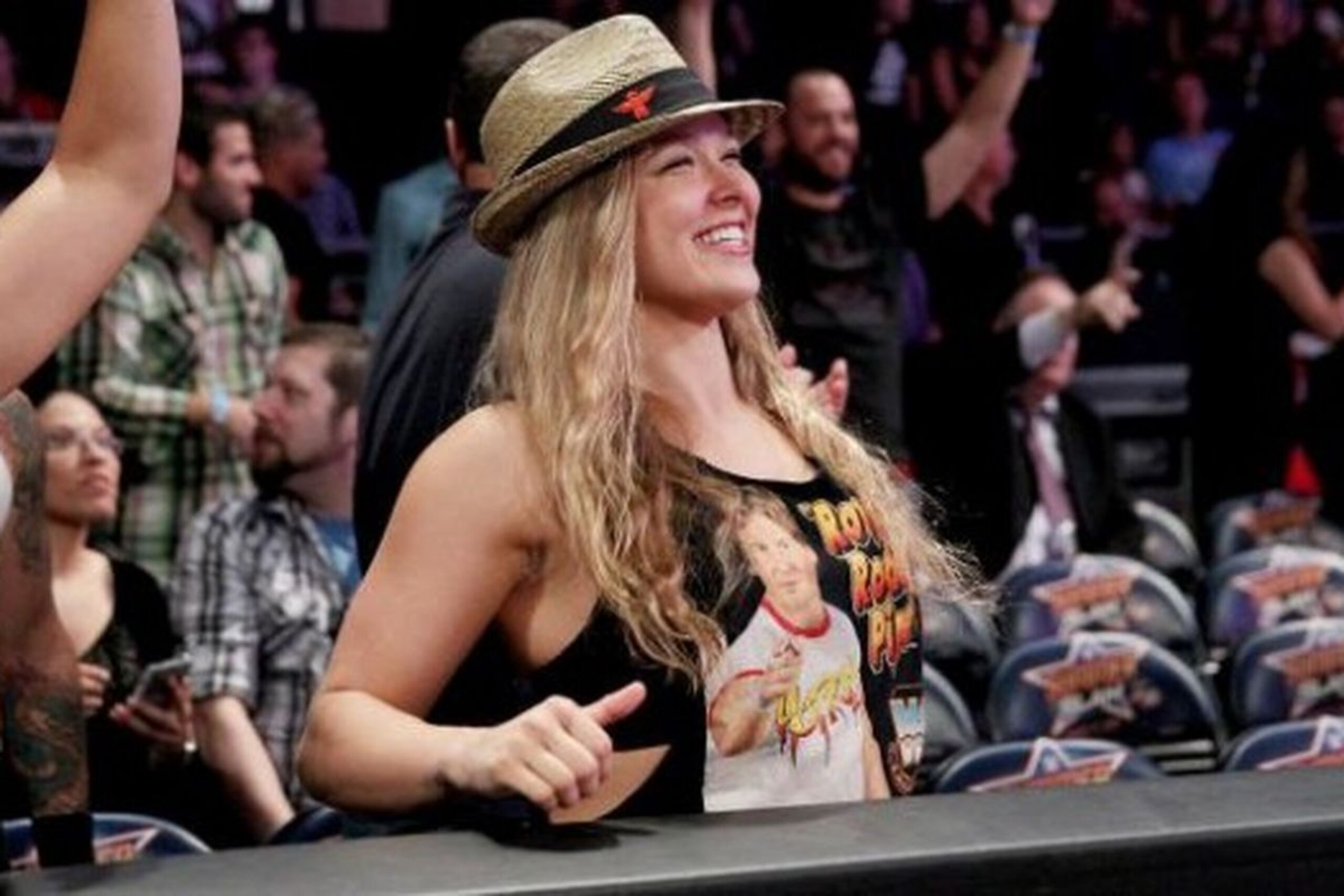 Ronda Rousey in the crowd at a WWE event.