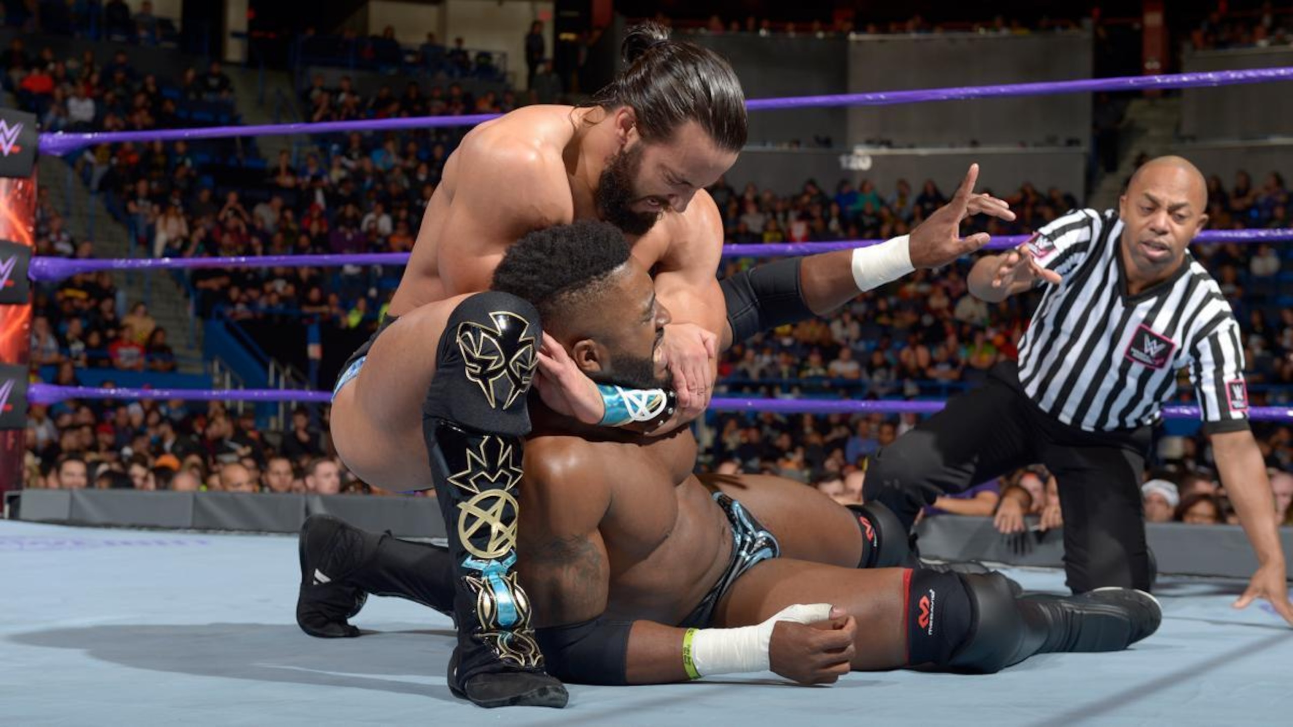 Tony Nese keeping Cedric Alexander grounded in a headlock.