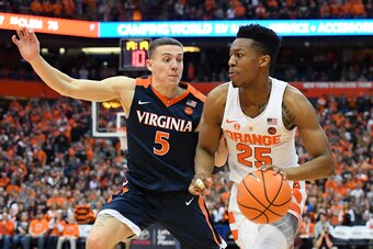 Kyle Guy (5) and Tyus Battle (25)
