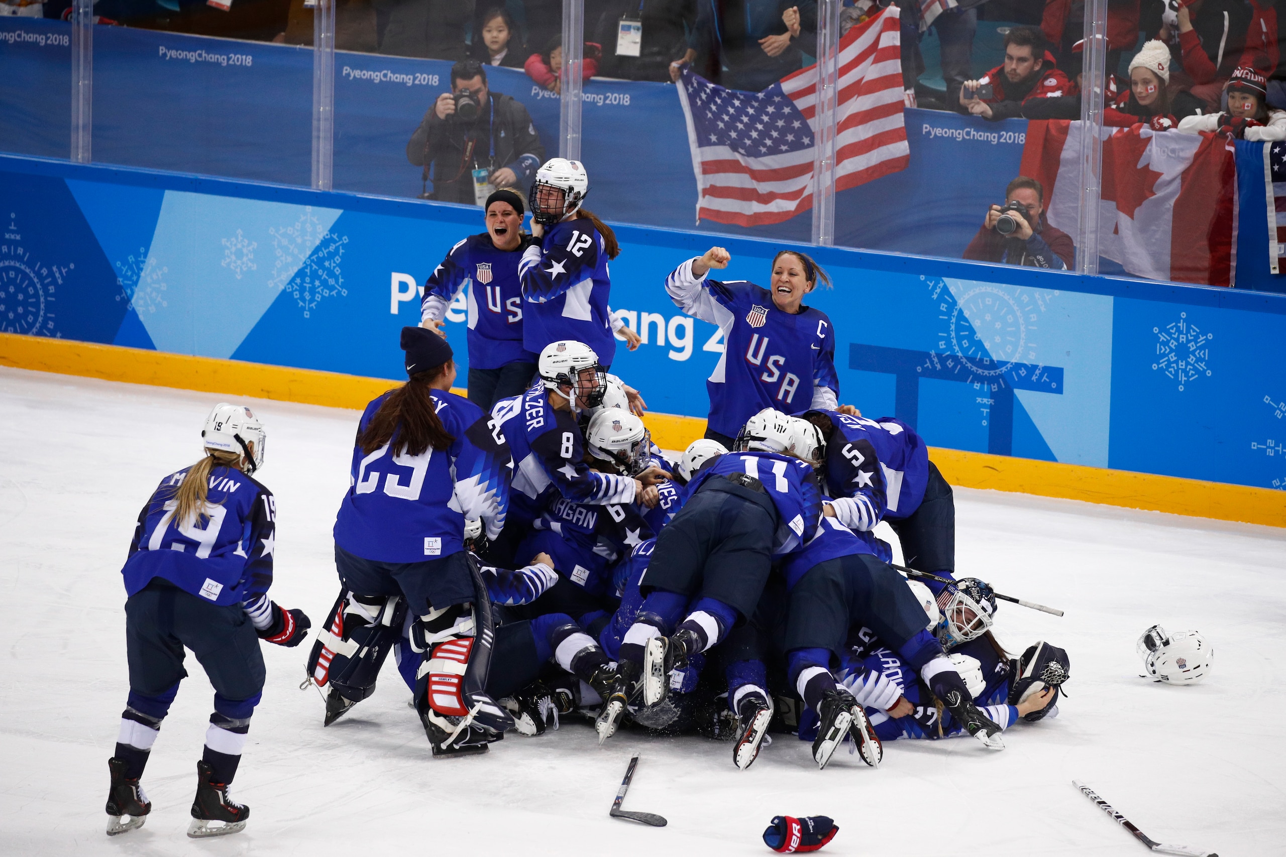 The U.S. women's hockey team celebrates after winning its first Olympic gold medal since 1998.