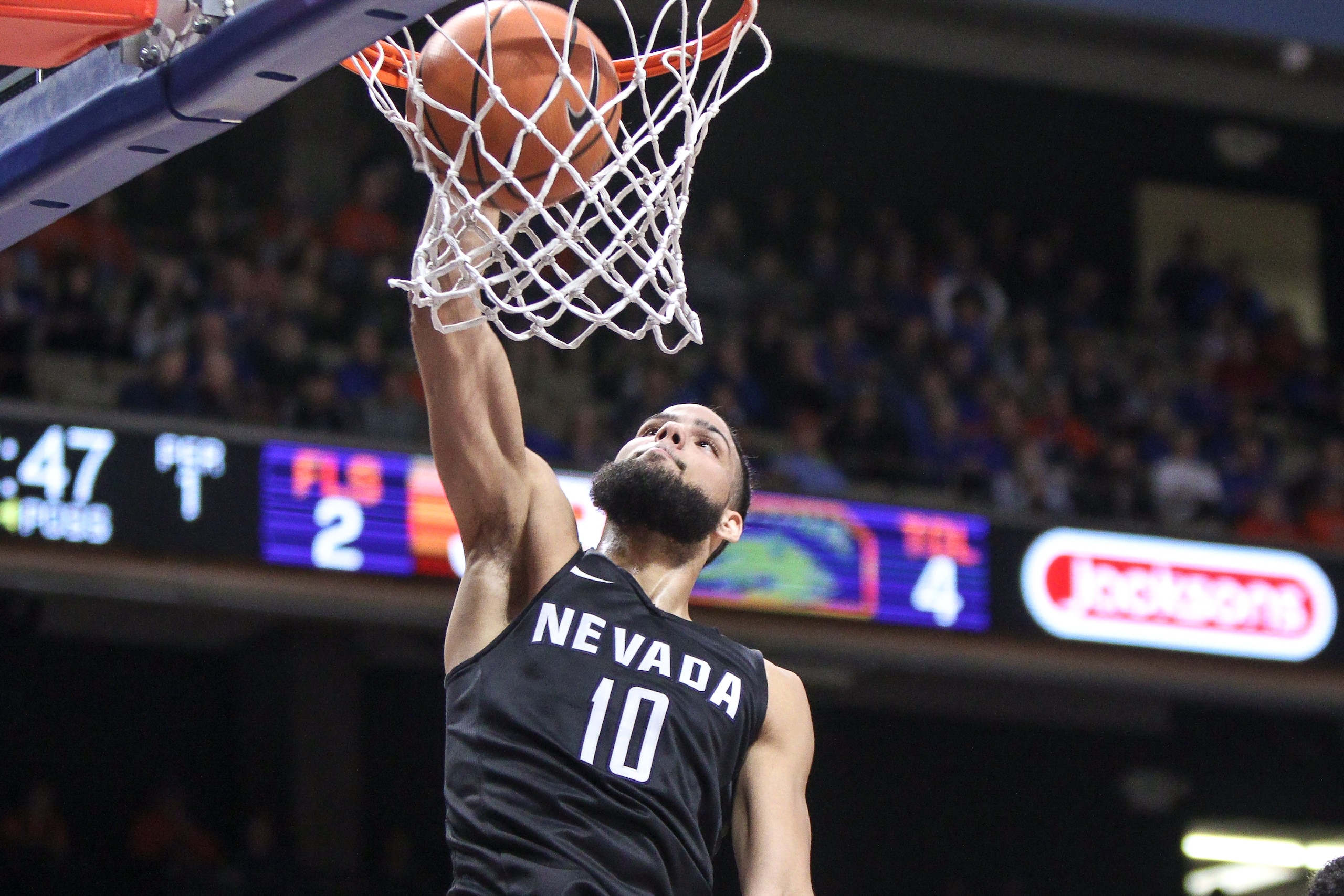 BOISE, ID - FEBRUARY 14: Forward Caleb Martin #10 of the Nevada Wolf Pack dunks the ball for two points during first-half action against the Boise State Broncos on February 14, 2018 at Taco Bell Arena in Boise, Idaho. (Photo by Loren Orr/Getty Images)