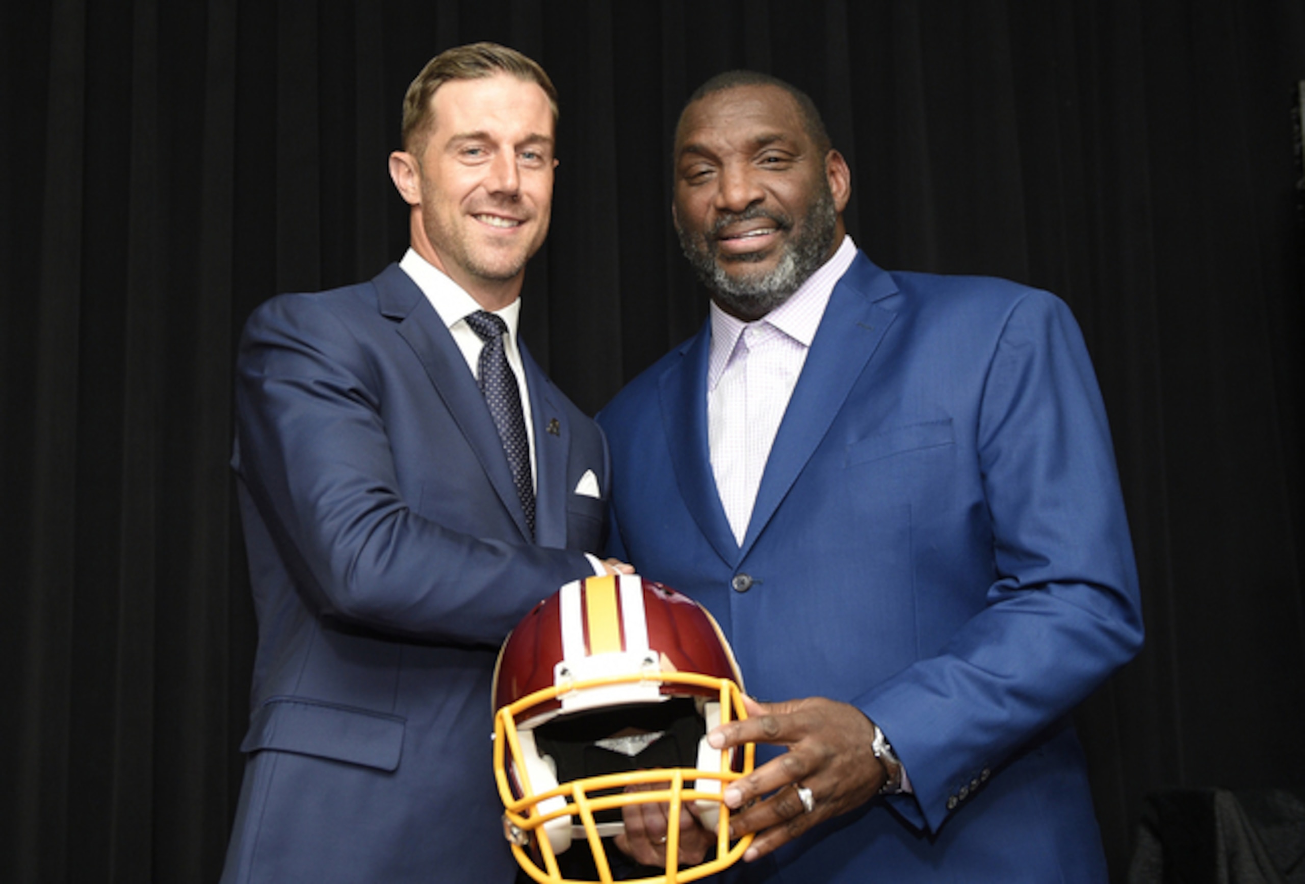 Washington quarterback Alex Smith (left) and team executive Doug Williams