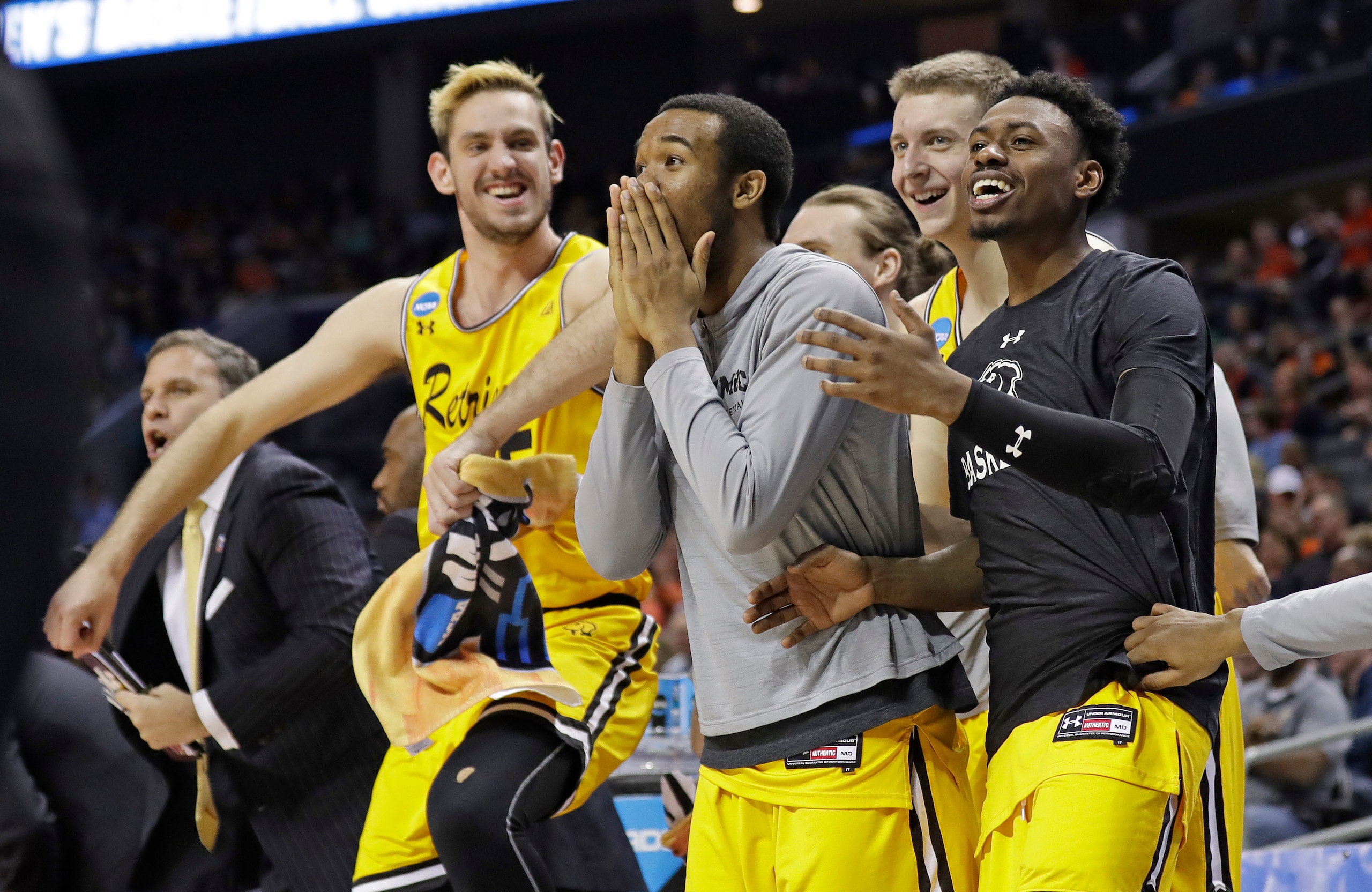 UMBC players react during their historic upset of top-seeded Virginia.