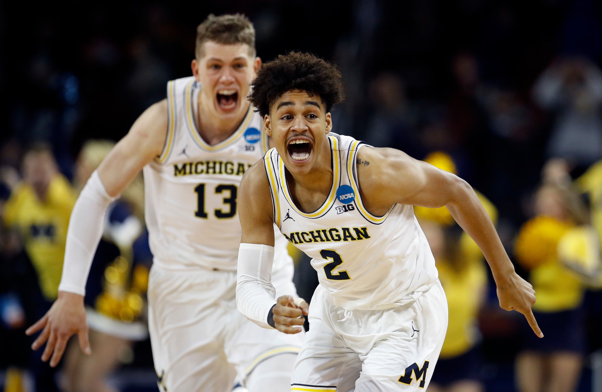 Jordan Poole (2) and Moritz Wagner (13)