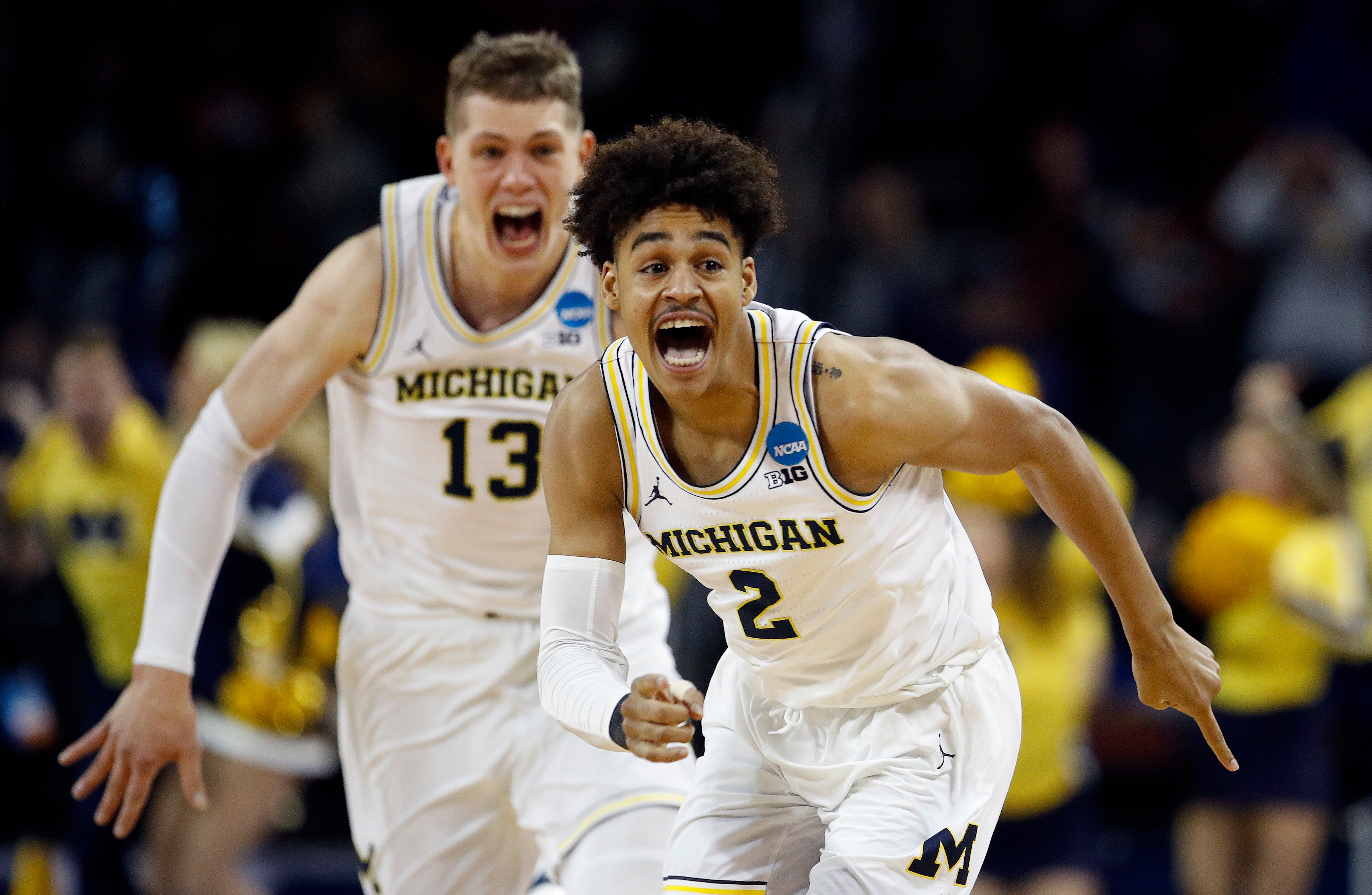 Jordan Poole (2) and Moritz Wagner (13)