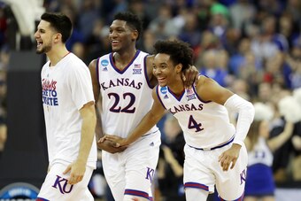 Devonte' Graham (4) and Silvio De Sousa (22)