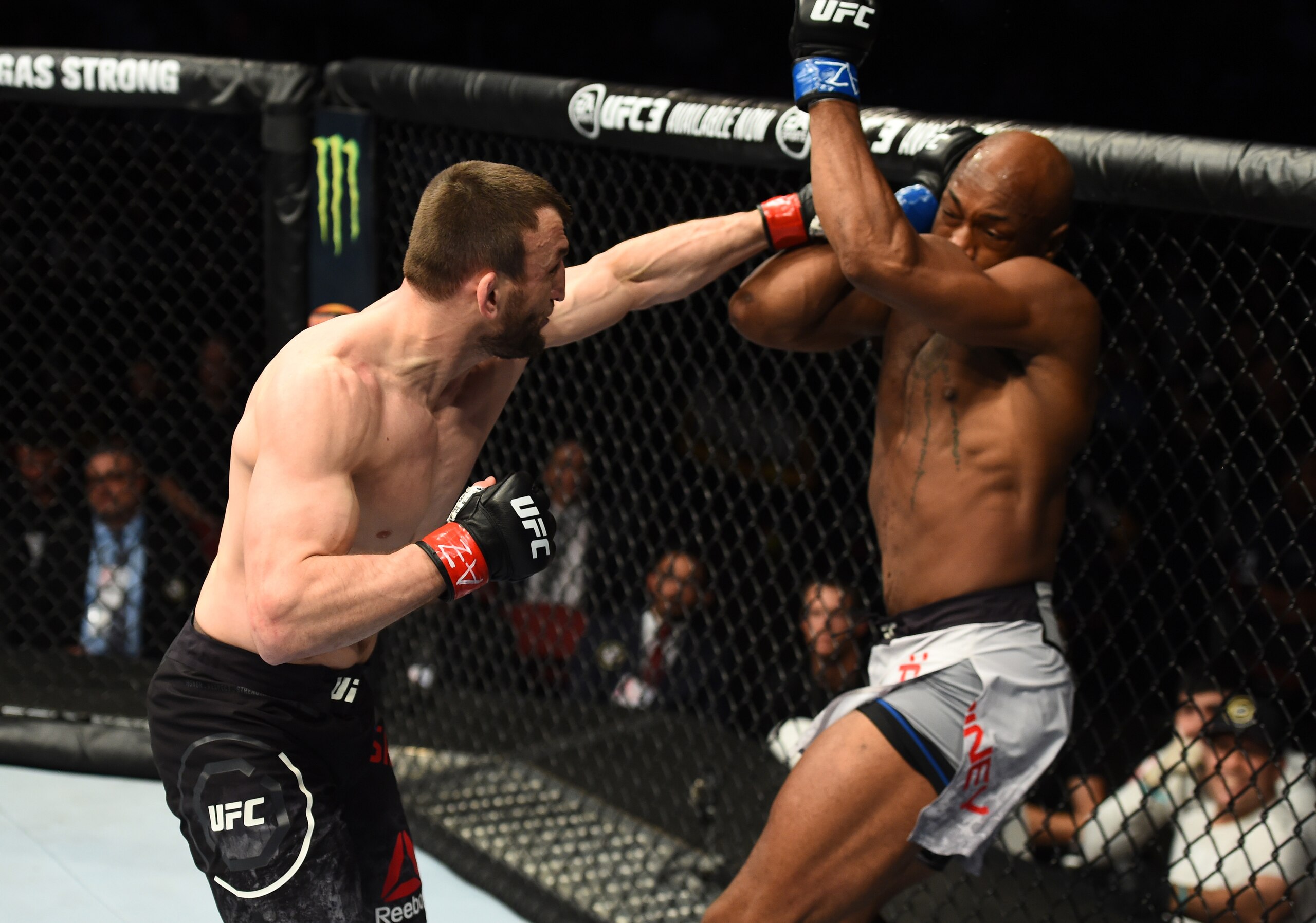 Muslim Salikhov (left) hits Ricky Rainey Muslim Salikhov (left) hits Ricky Rainey