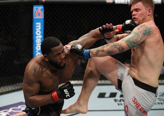 Justin Willis (left) hits Chase Sherman