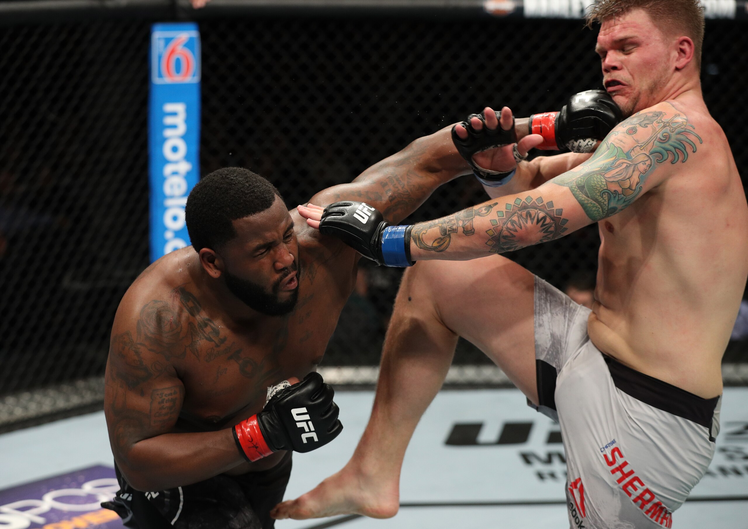 Justin Willis (left) hits Chase Sherman