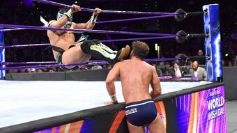 Kalisto taking out Drew Gulak with a dropkick through the ropes.