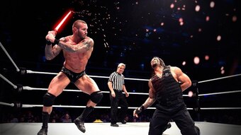 Randy Orton testing the limits of Roman Reigns' chest protector.