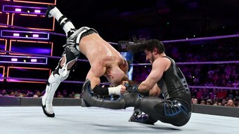 Mustafa Ali hitting Buddy Murphy with a facebuster