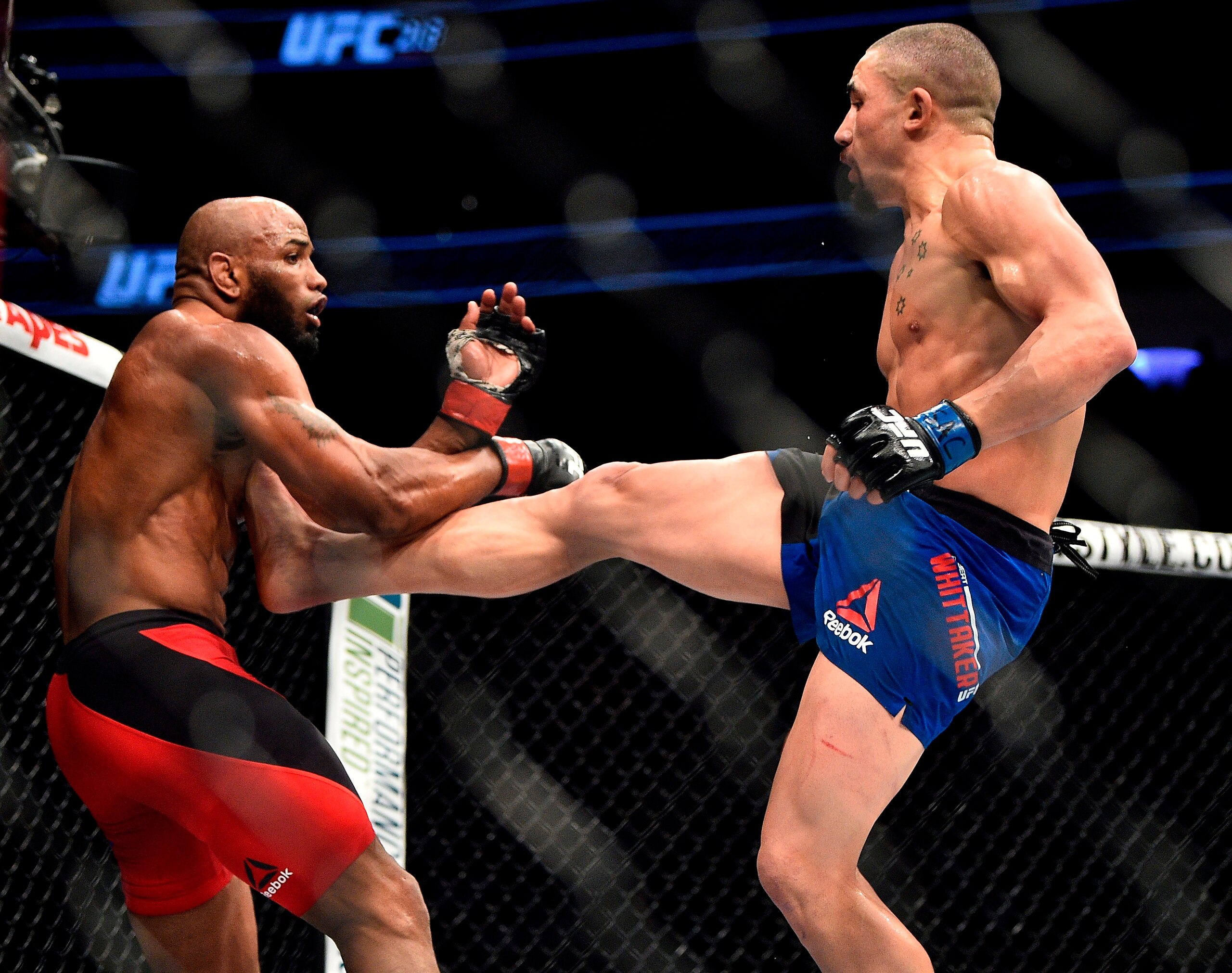 Romero (left) tries to fend off a Whittaker kick last July.