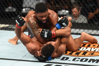 Curtis Blaydes (top) lands an elbow on Alistair Overeem