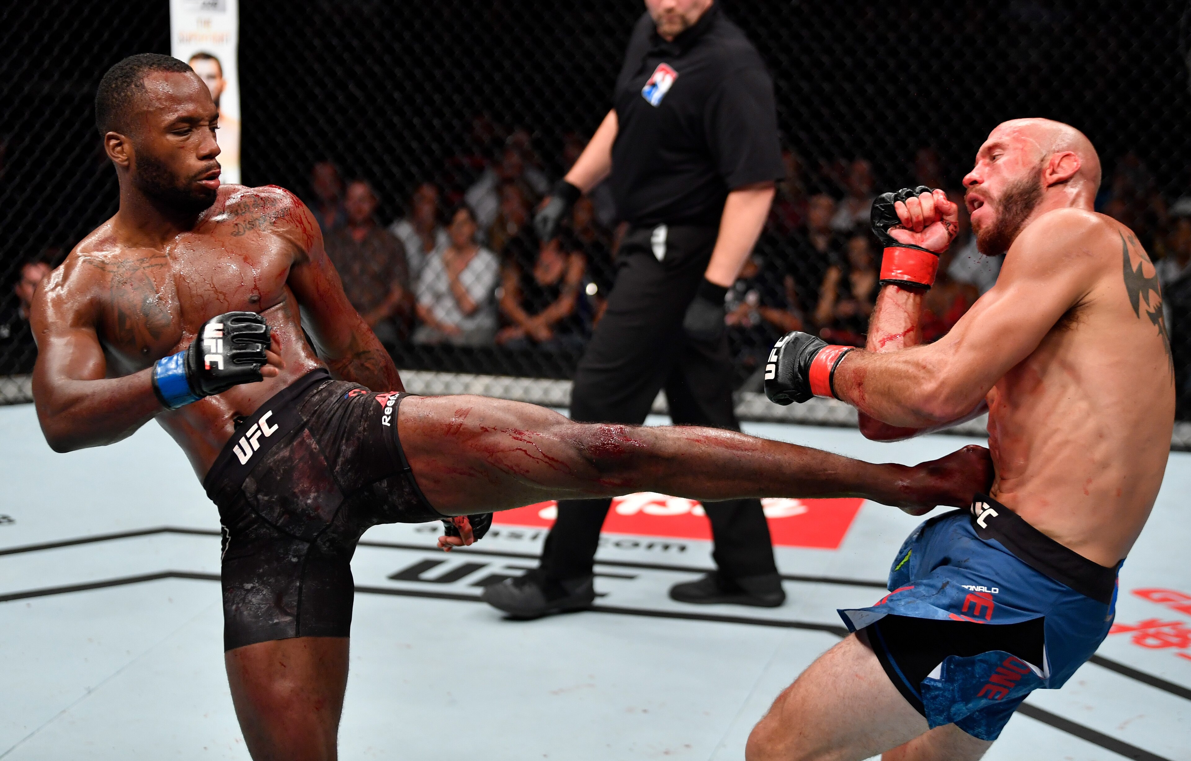 Leon Edwards (left) kicks Donald Cerrone Leon Edwards (left) kicks Donald Cerrone
