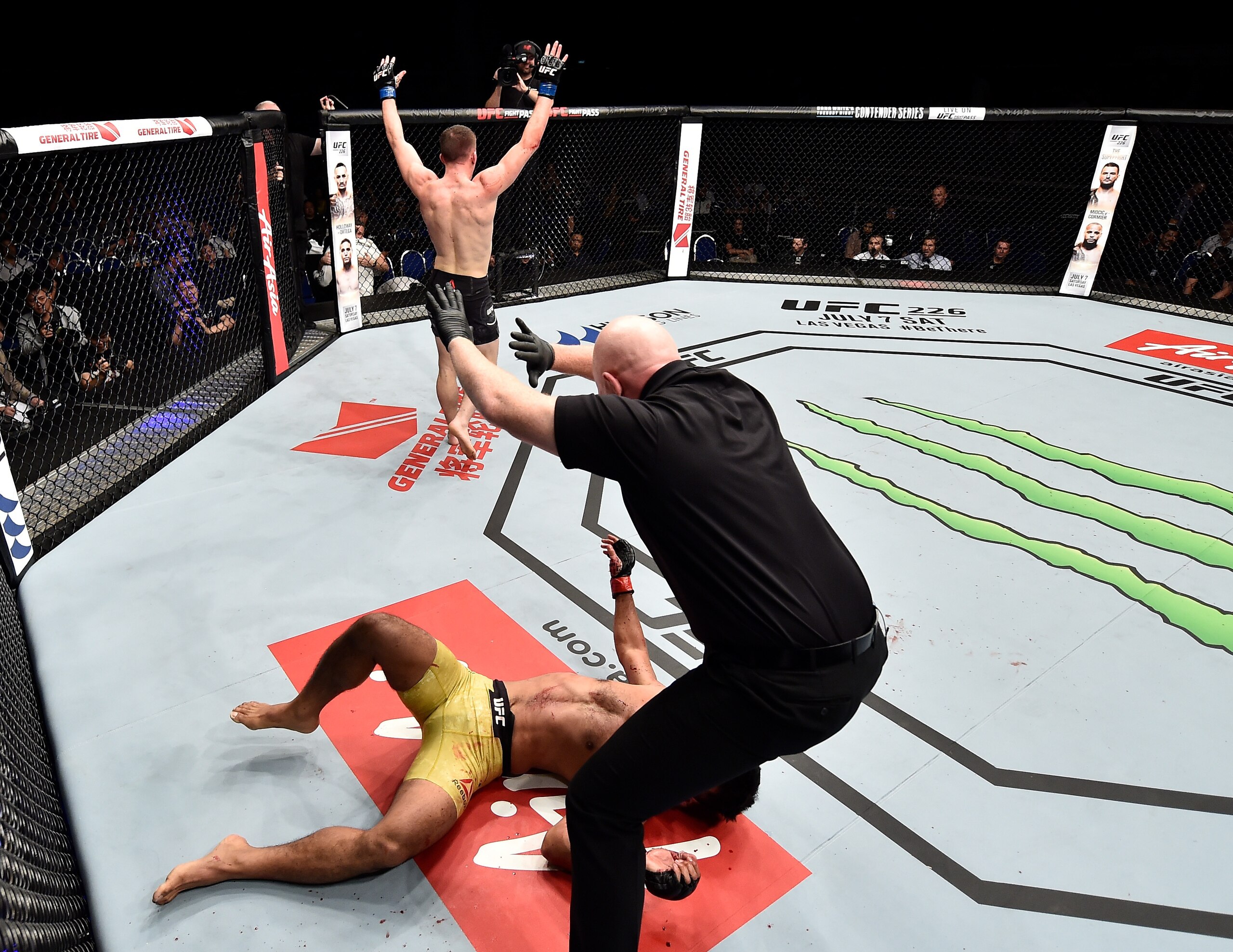 Shane Young walks off after knocking out Rolando Dy.