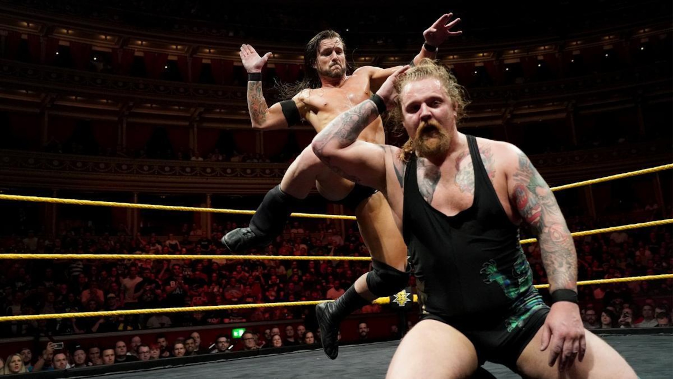 Adam Cole about to kick off Wolfgang's head