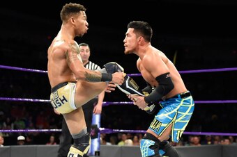 Lio Rush attempting to kick Akira Tozawa.