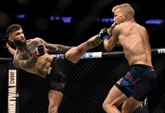 Cody Garbrandt (left) kicks TJ Dillashaw during their first meeting.