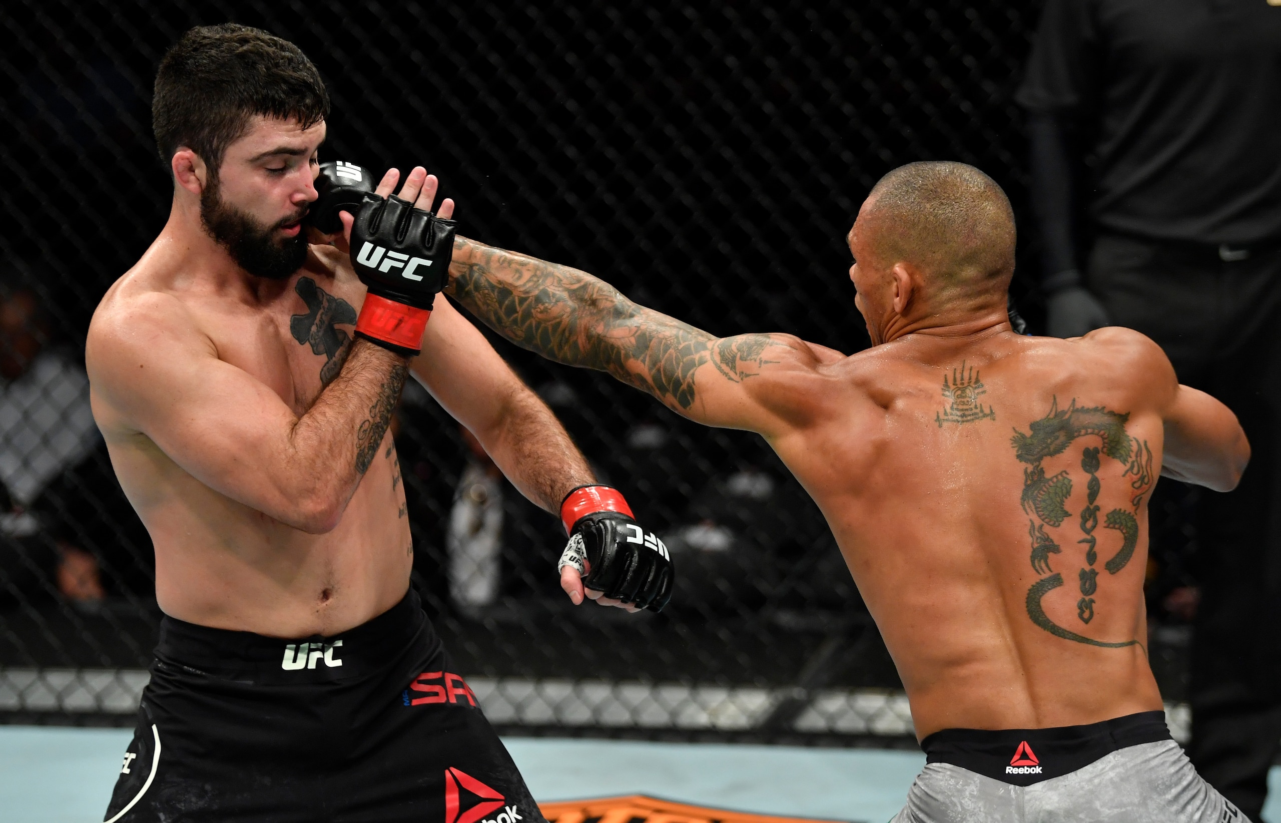 Matt Sayles (left) catches an eye poke from Sheymon Moraes.