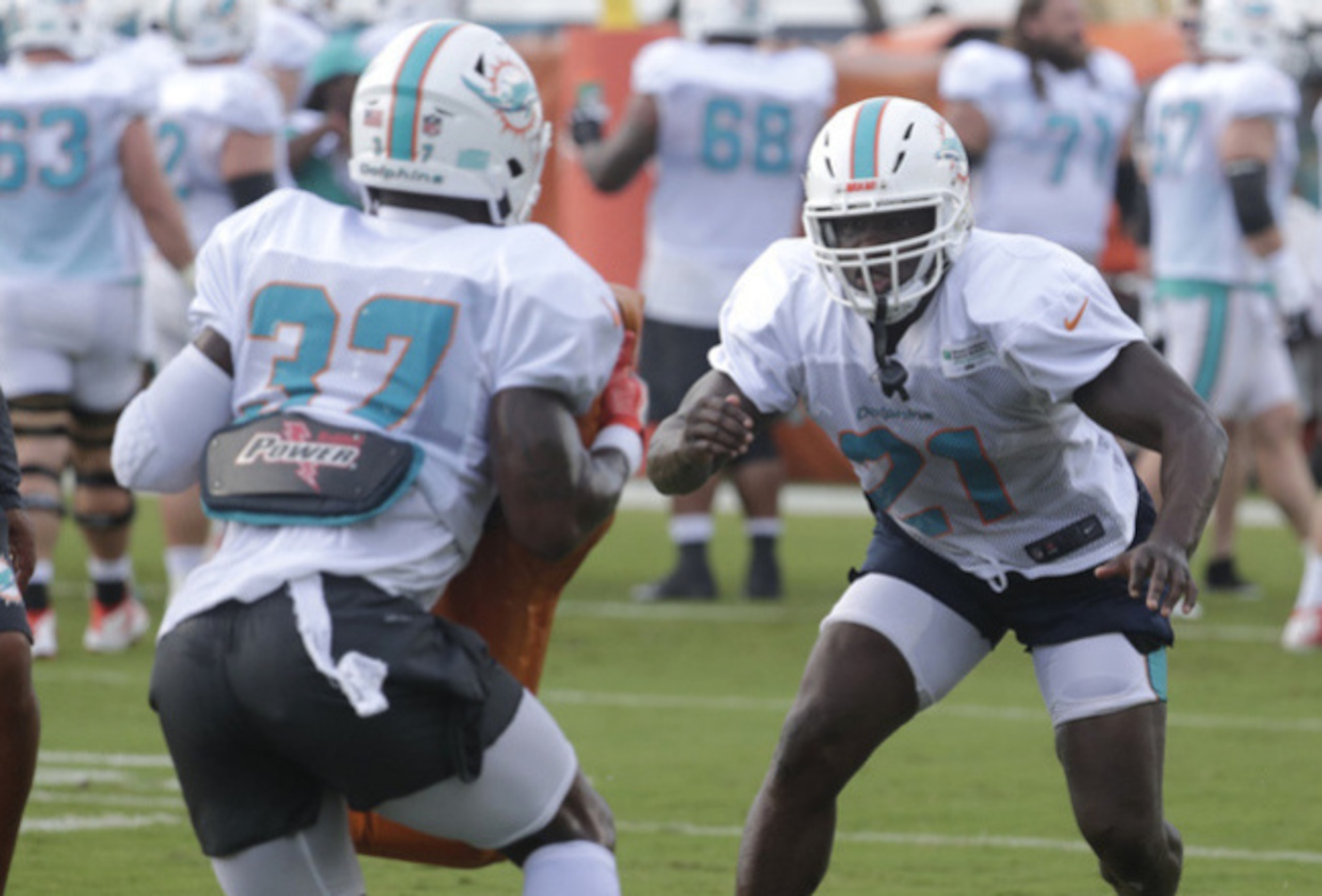 Miami Dolphins running backs Kenyan Drake (32) and Frank Gore (21)