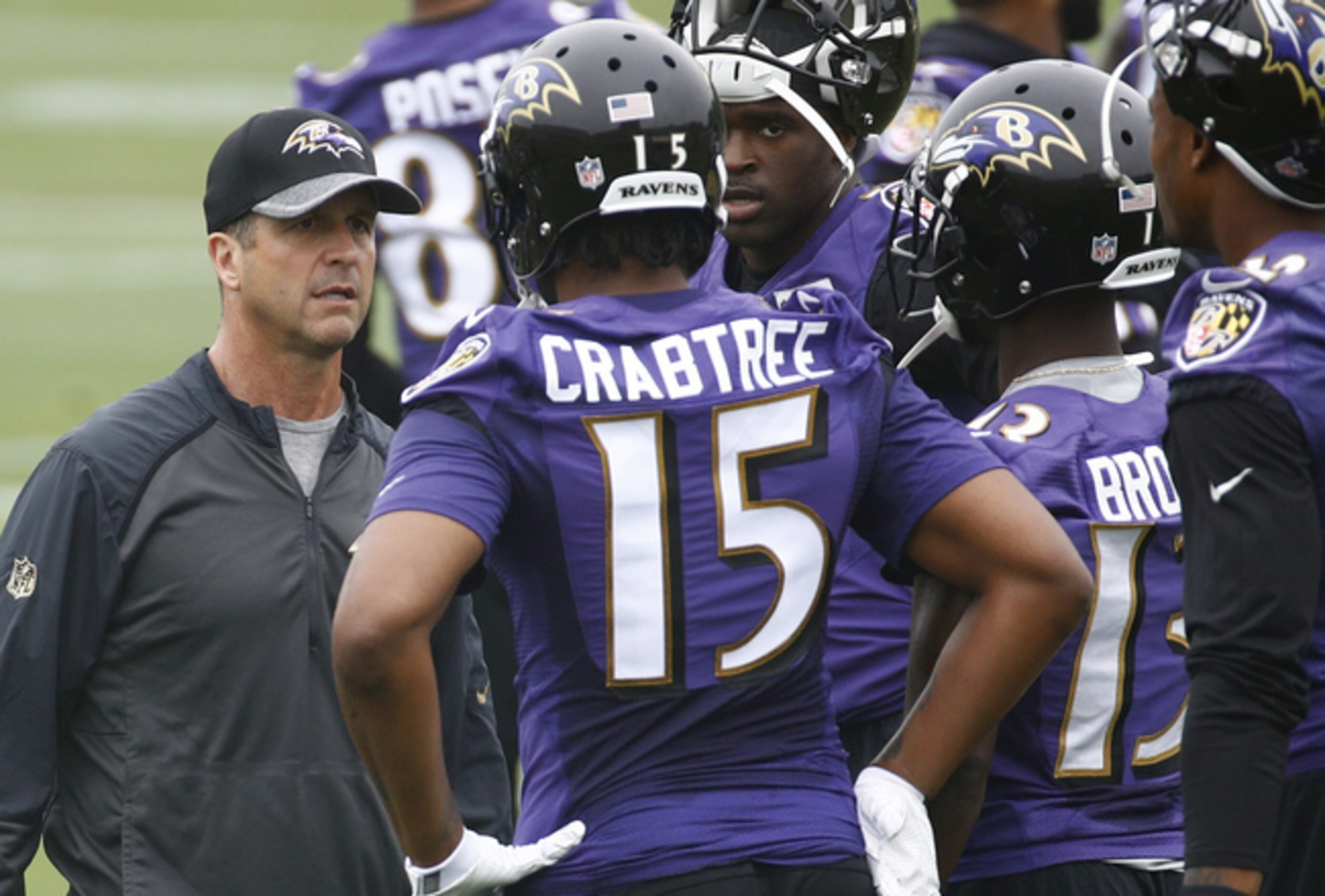 Baltimore Ravens head coach John Harbaugh speaks with wide receiver Michael Crabtree (15) and John Brown (13). Baltimore Ravens head coach John Harbaugh speaks with wide receiver Michael Crabtree (15) and John Brown (13).