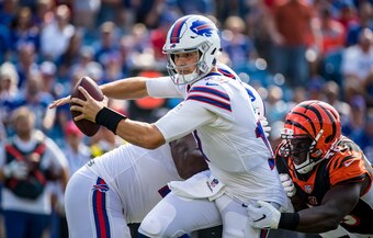 Buffalo Bills quarterback Josh Allen evades pressure.