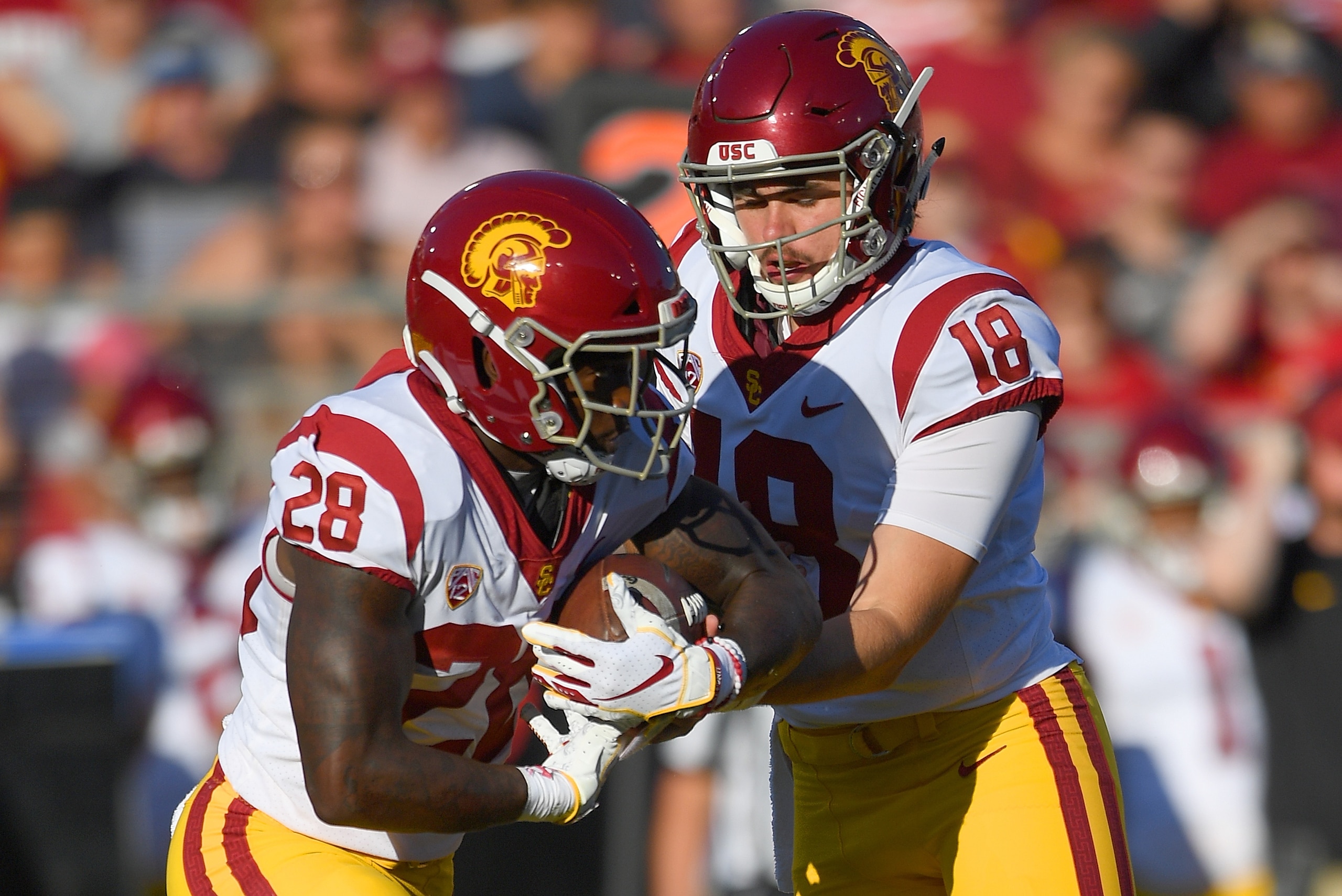 JT Daniels (18) and Aca'Cedric Ware (28) JT Daniels (18) and Aca'Cedric Ware (28)