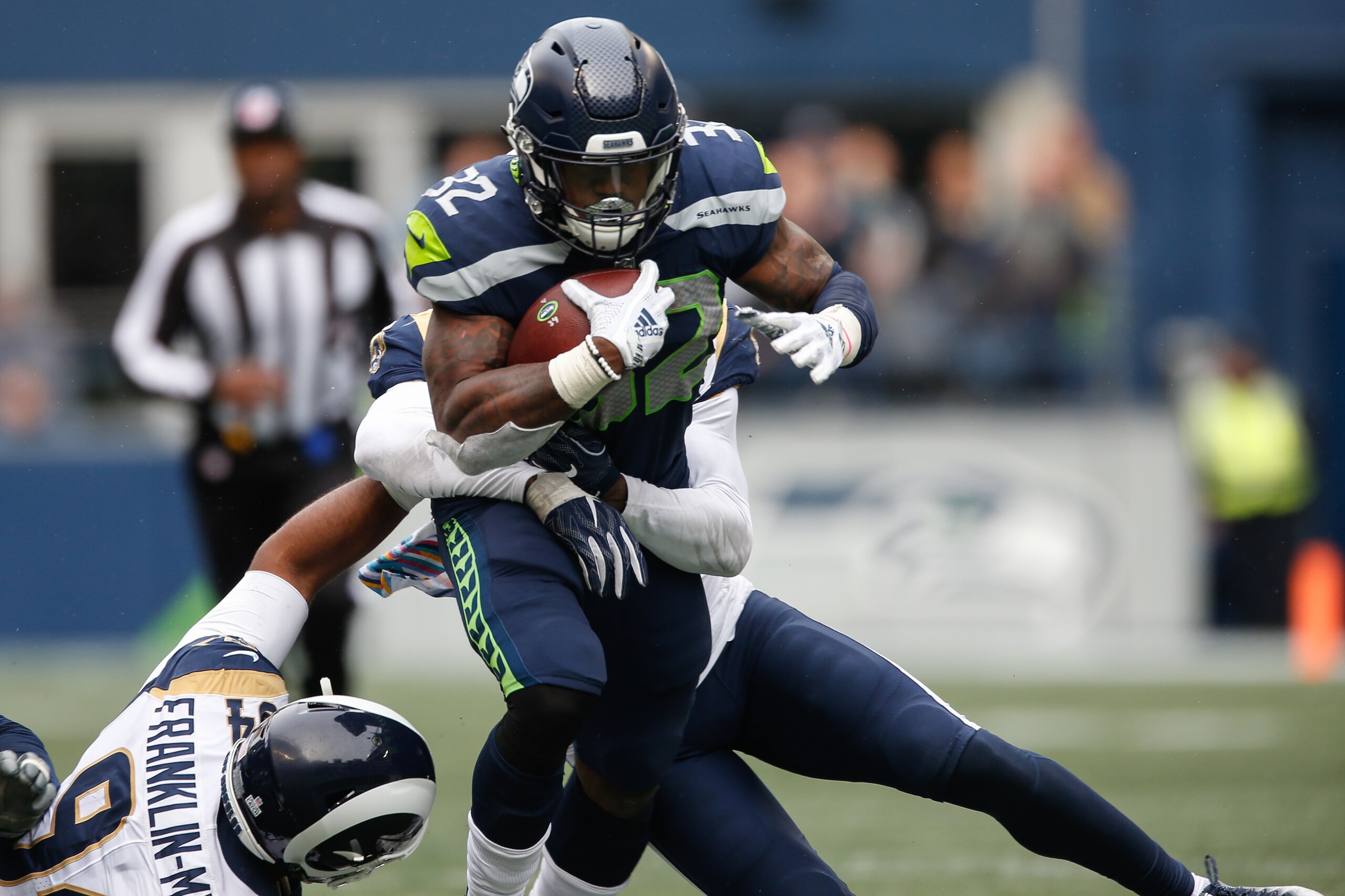 Chris Carson battled his way through the Rams defense.