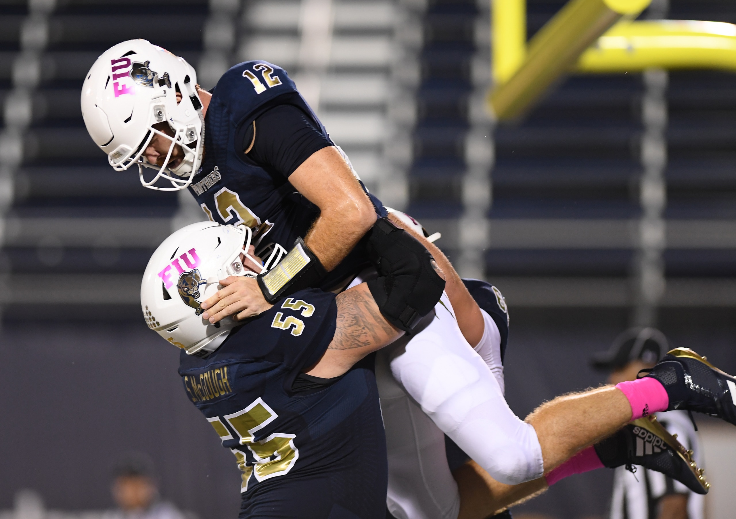 FIU's James Morgan (12) and Shane McGough (55) FIU's James Morgan (12) and Shane McGough (55)