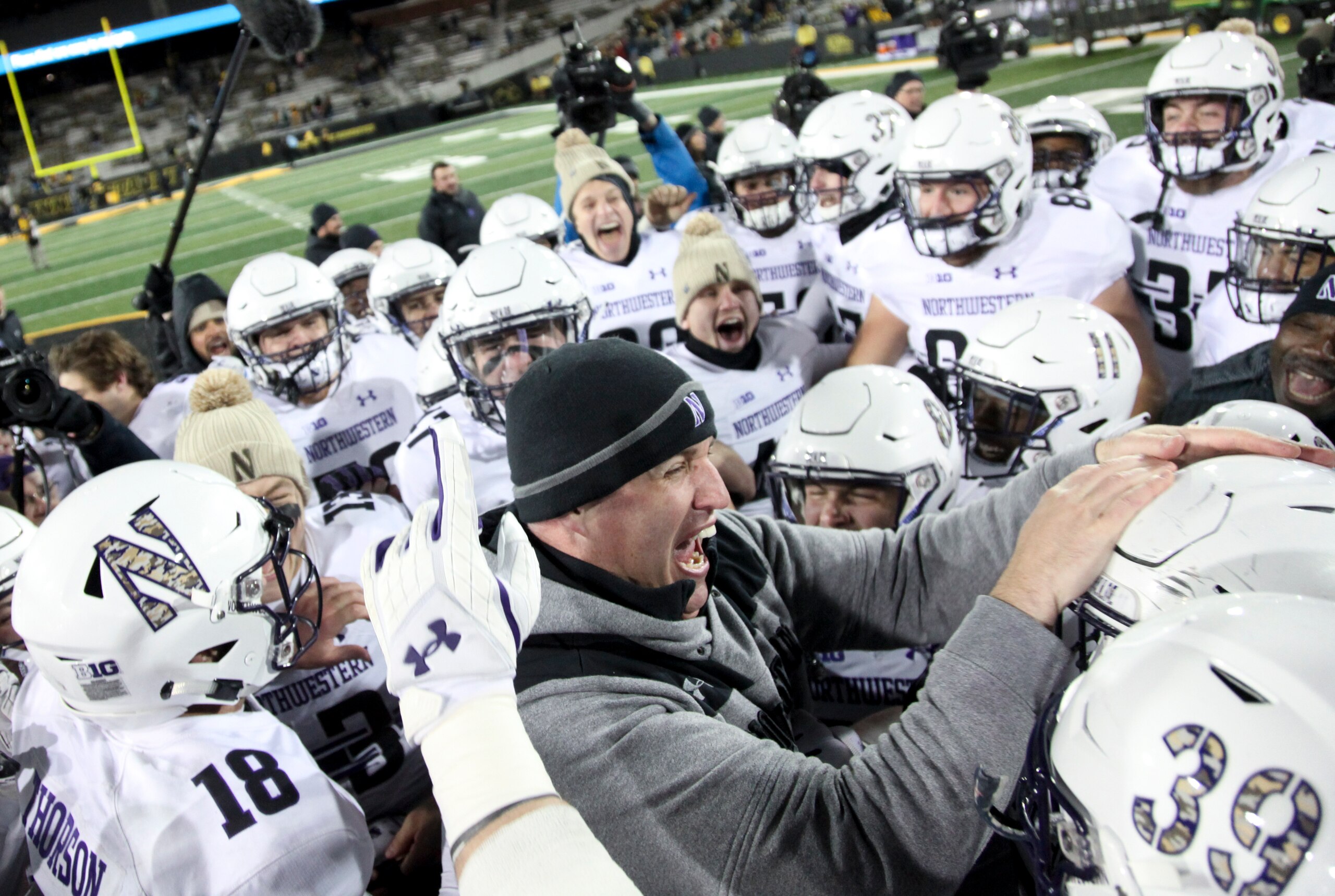 Pat Fitzgerald and Northwestern celebrate winning the Big Ten West Division. Pat Fitzgerald and Northwestern celebrate winning the Big Ten West Division.
