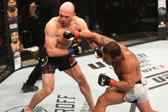Michel Prazeres (right) hits Bartosz Fabinski.