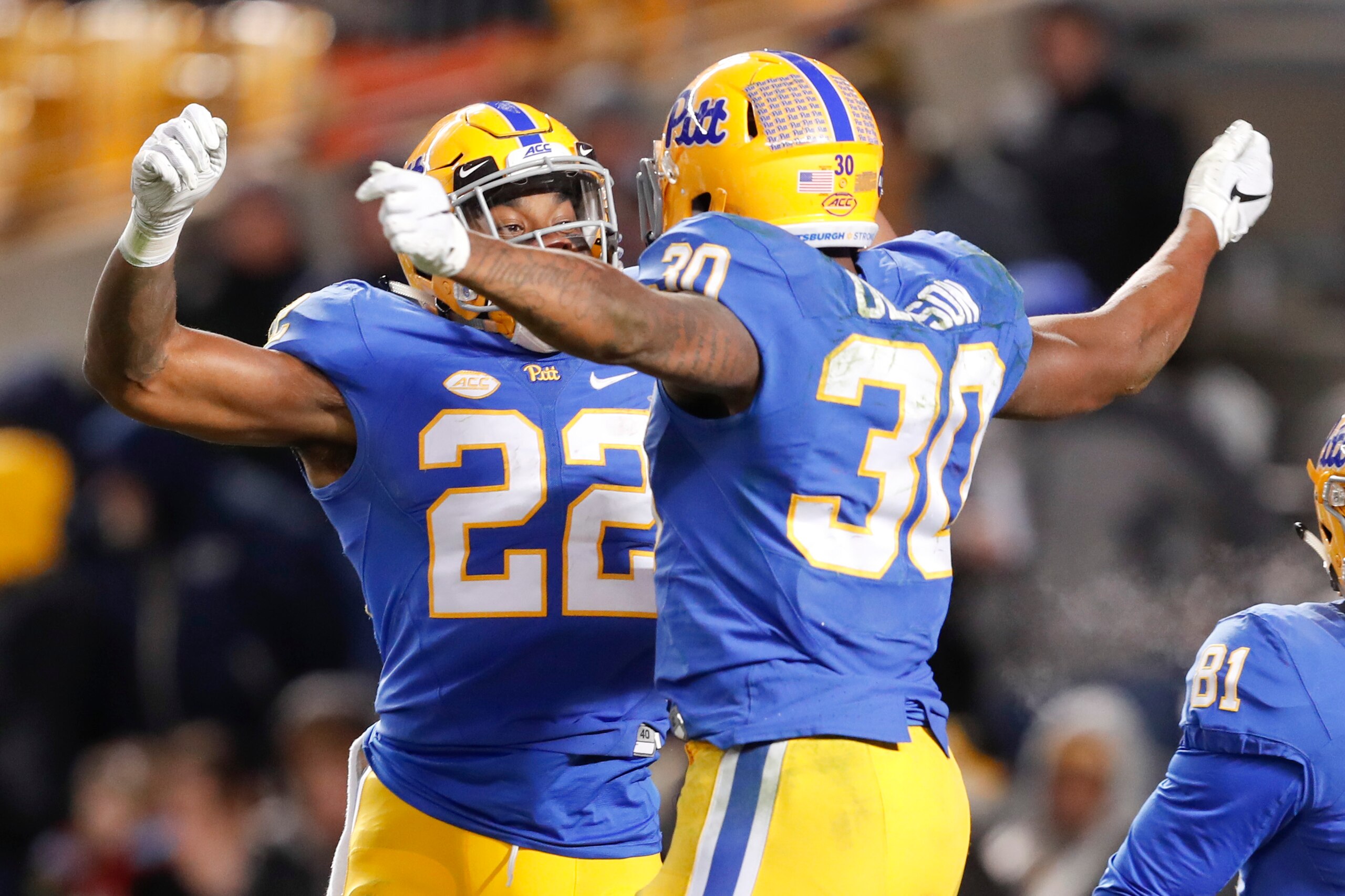 Pittsburgh's Darrin Hall (22) and Qadree Ollison (30)