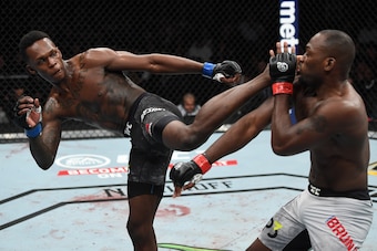 NEW YORK, NY - NOVEMBER 03:  (L-R) Israel Adesanya of Nigeria kicks Derek Brunson in their middleweight bout during the UFC 230 event inside Madison Square Garden on November 3, 2018 in New York, New York. (Photo by Jeff Bottari/Zuffa LLC/Zuffa LLC via Ge