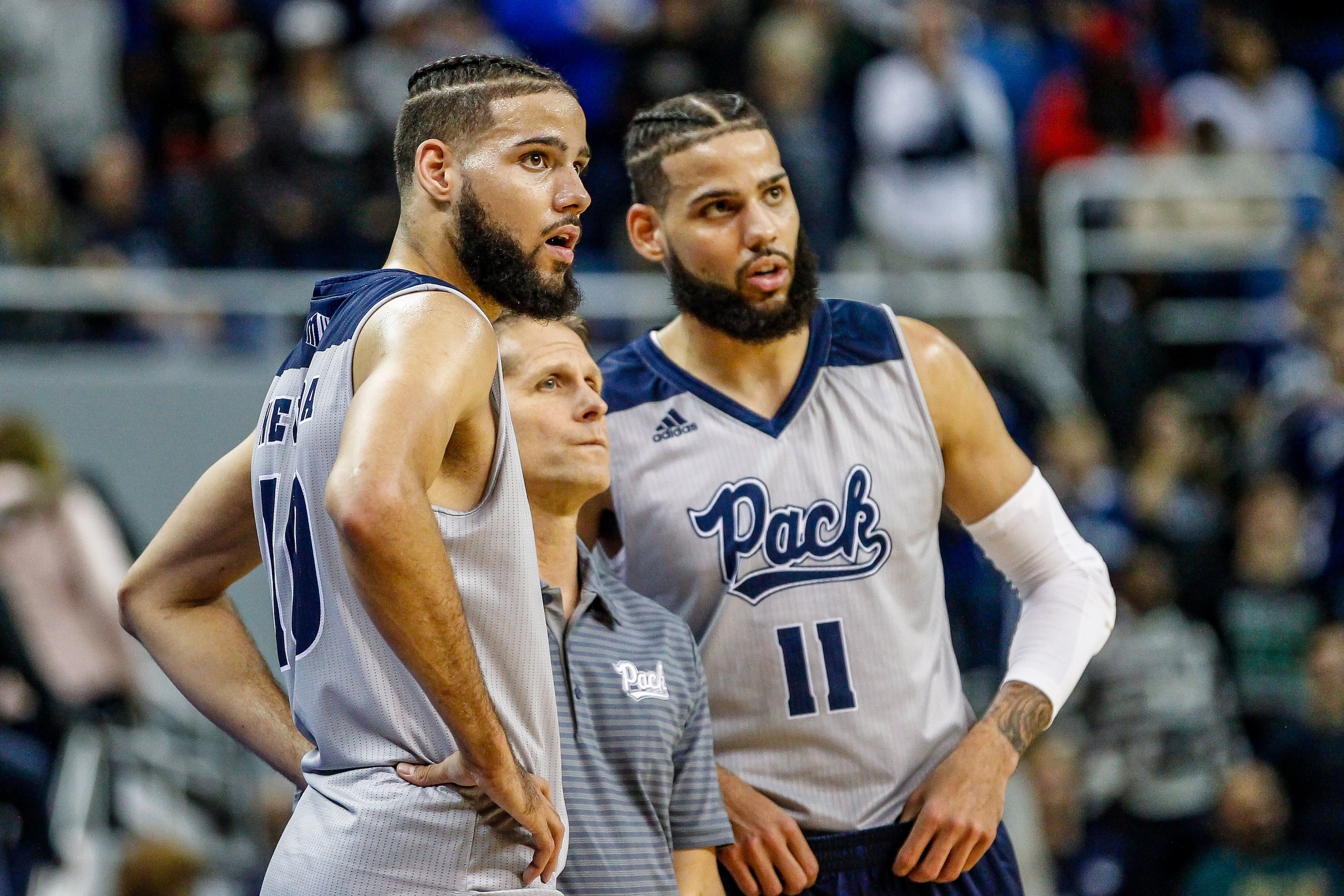 Nevada's Caleb Martin (10) and Cody Martin (11)
