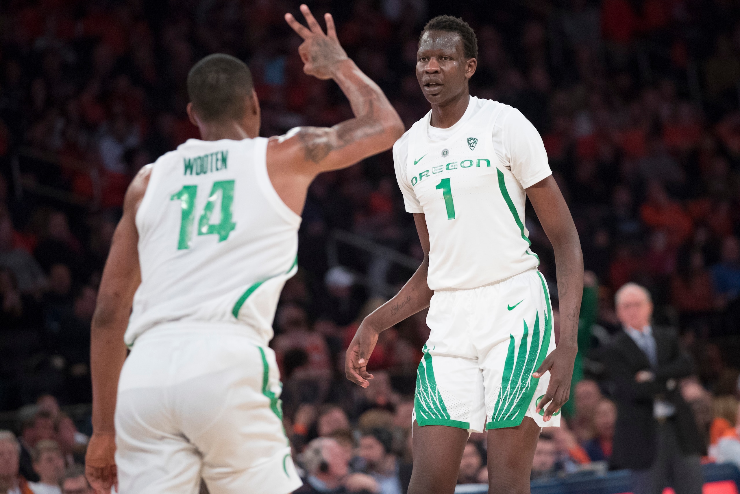 Oregon's Bol Bol (1) and Kenny Wooten (14)