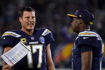 Los Angeles Chargers quarterbacks Philip Rivers (left) and Geno Smith (right)