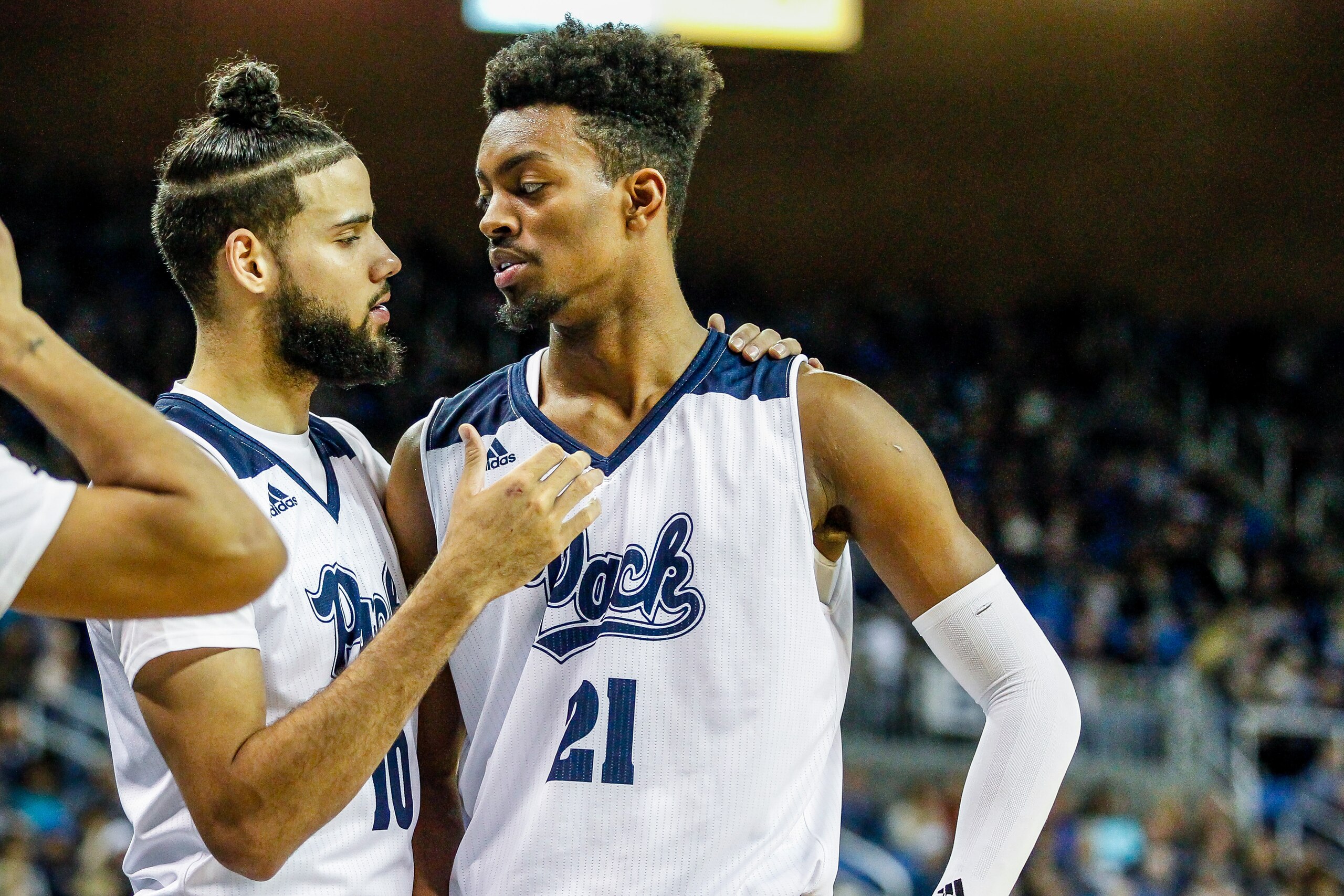 Jordan Brown (21) and Caleb Martin (10)