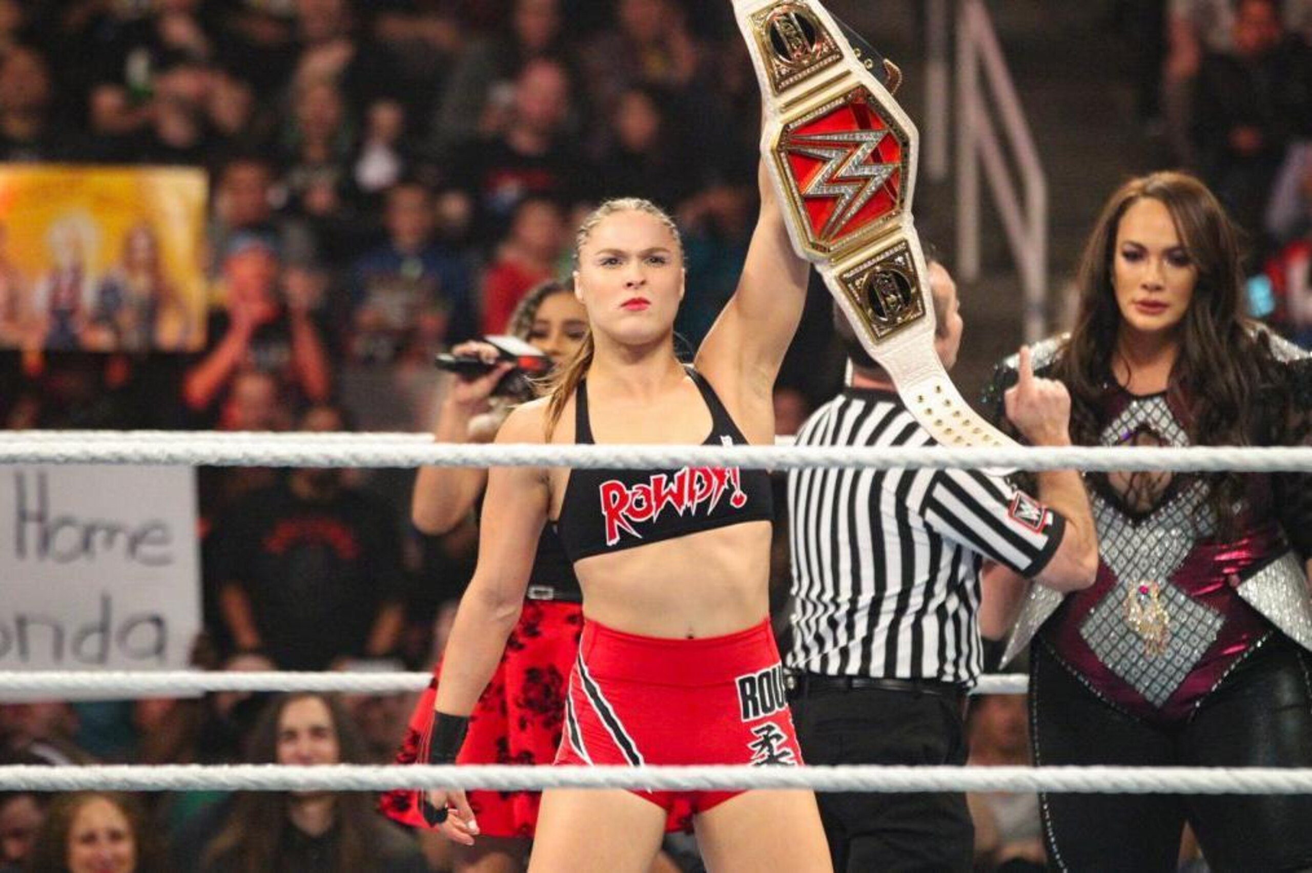 Ronda Rousey with the Raw women's title.