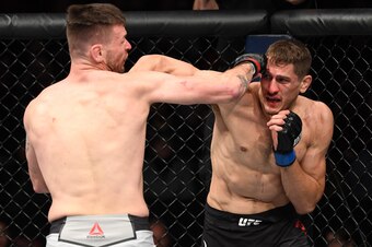 Niko Price (right) lands a punch on Tim Means