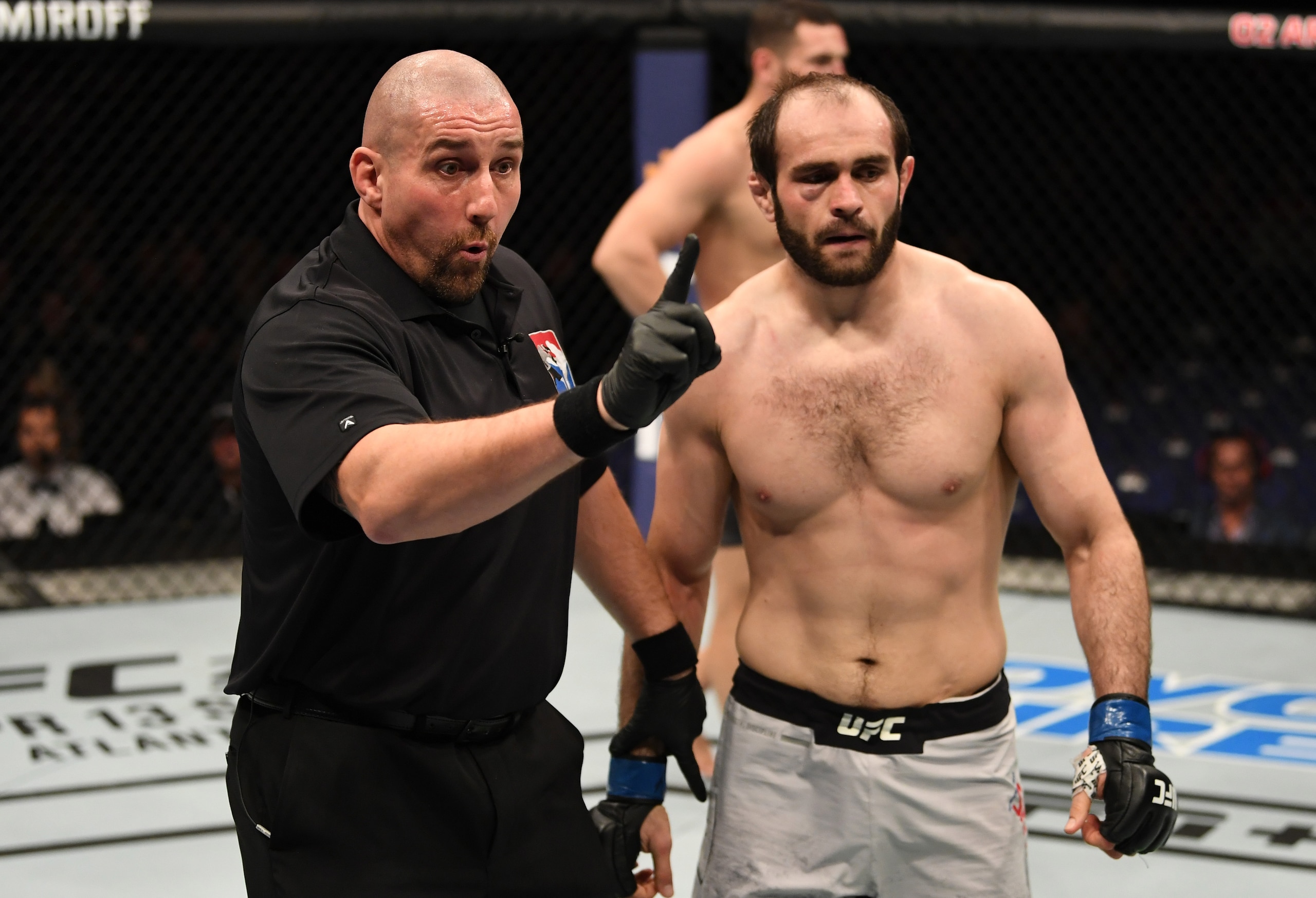 Referee Leon Roberts (left) deducts a point from Saparbek Safarov. Referee Leon Roberts (left) deducts a point from Saparbek Safarov.