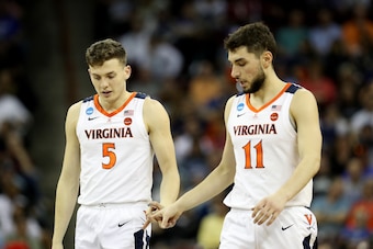 Kyle Guy (5) and Ty Jerome (11)