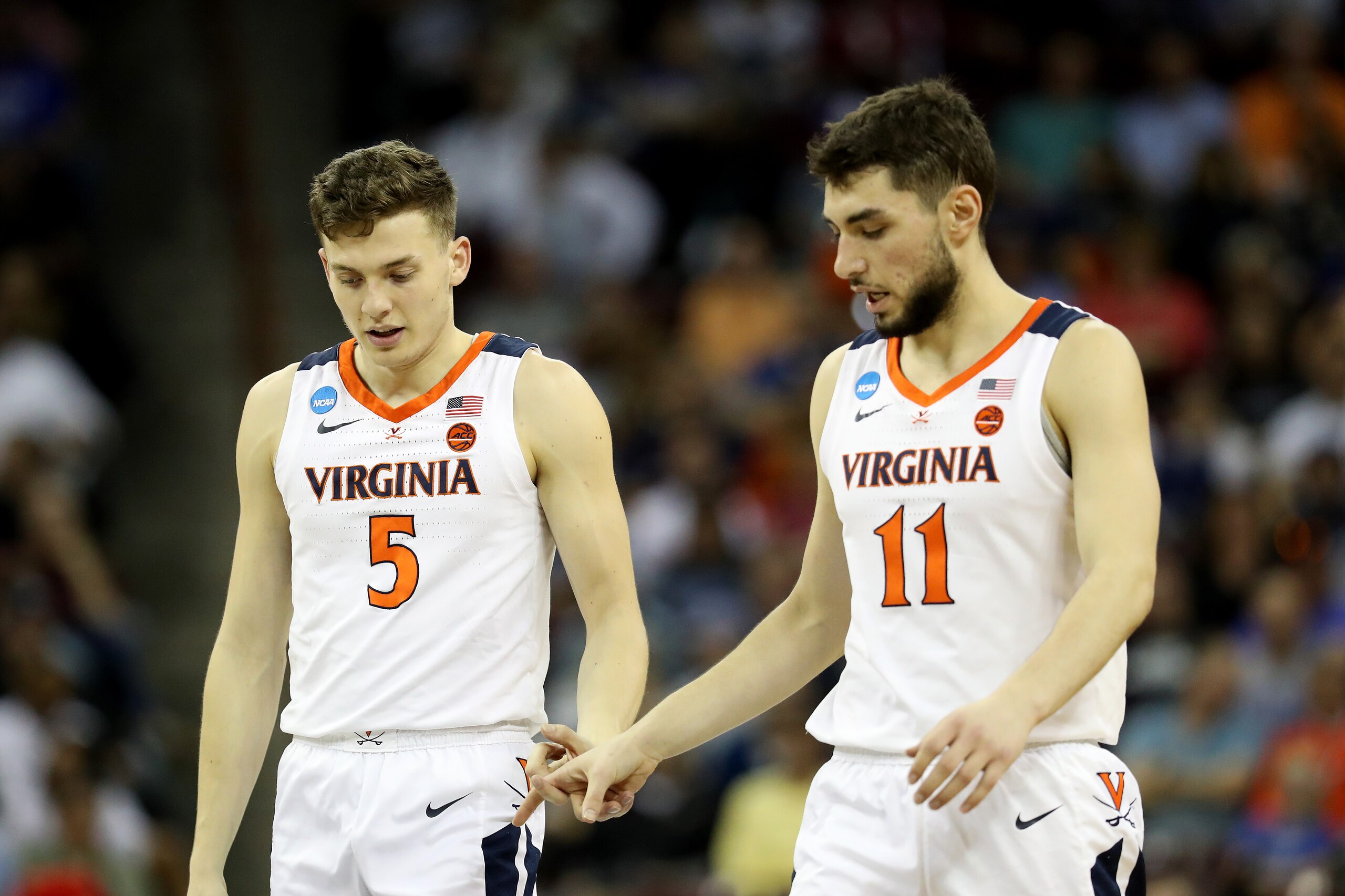 Kyle Guy (5) and Ty Jerome (11)