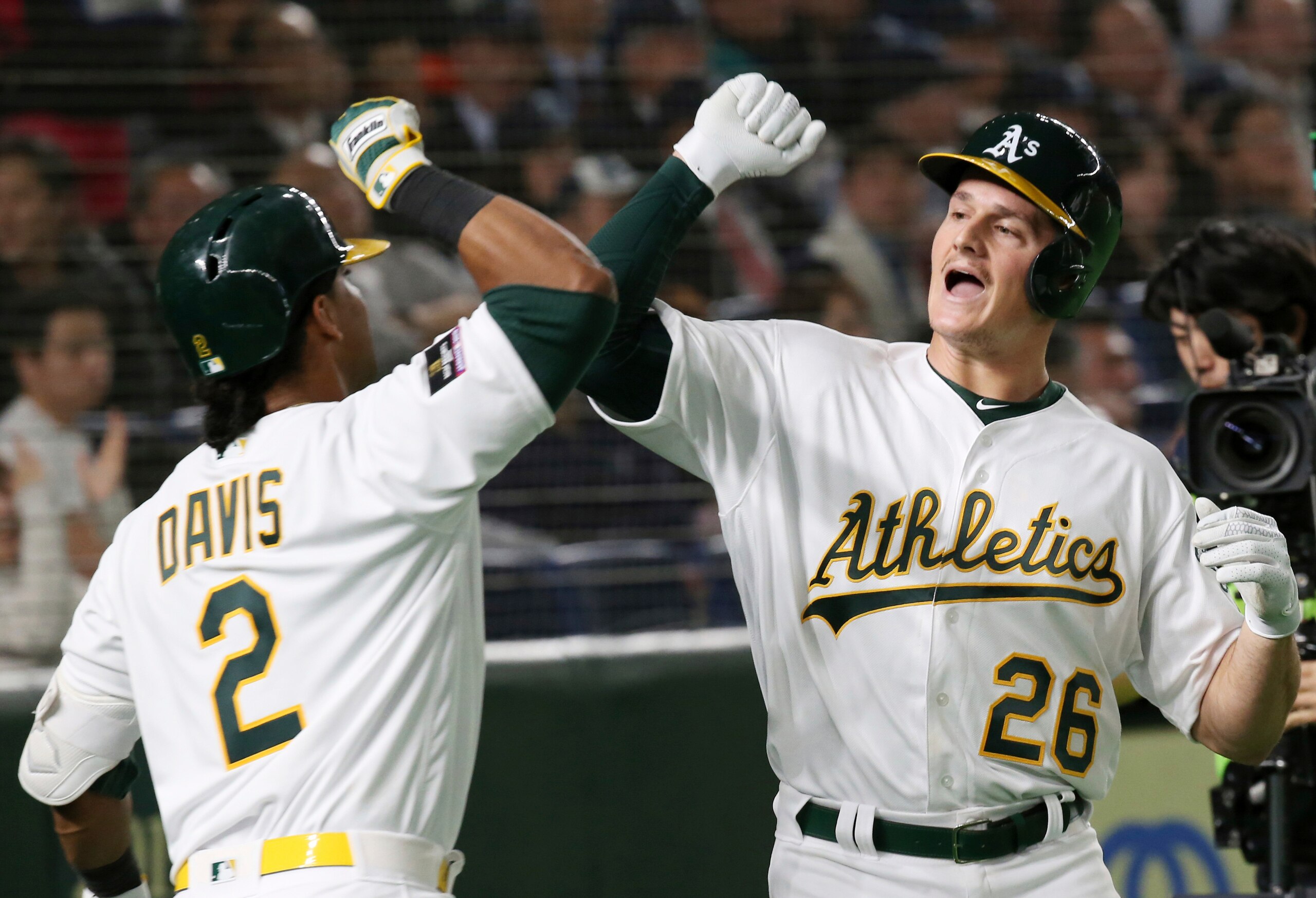 Khris Davis (L) and Matt Chapman (R)