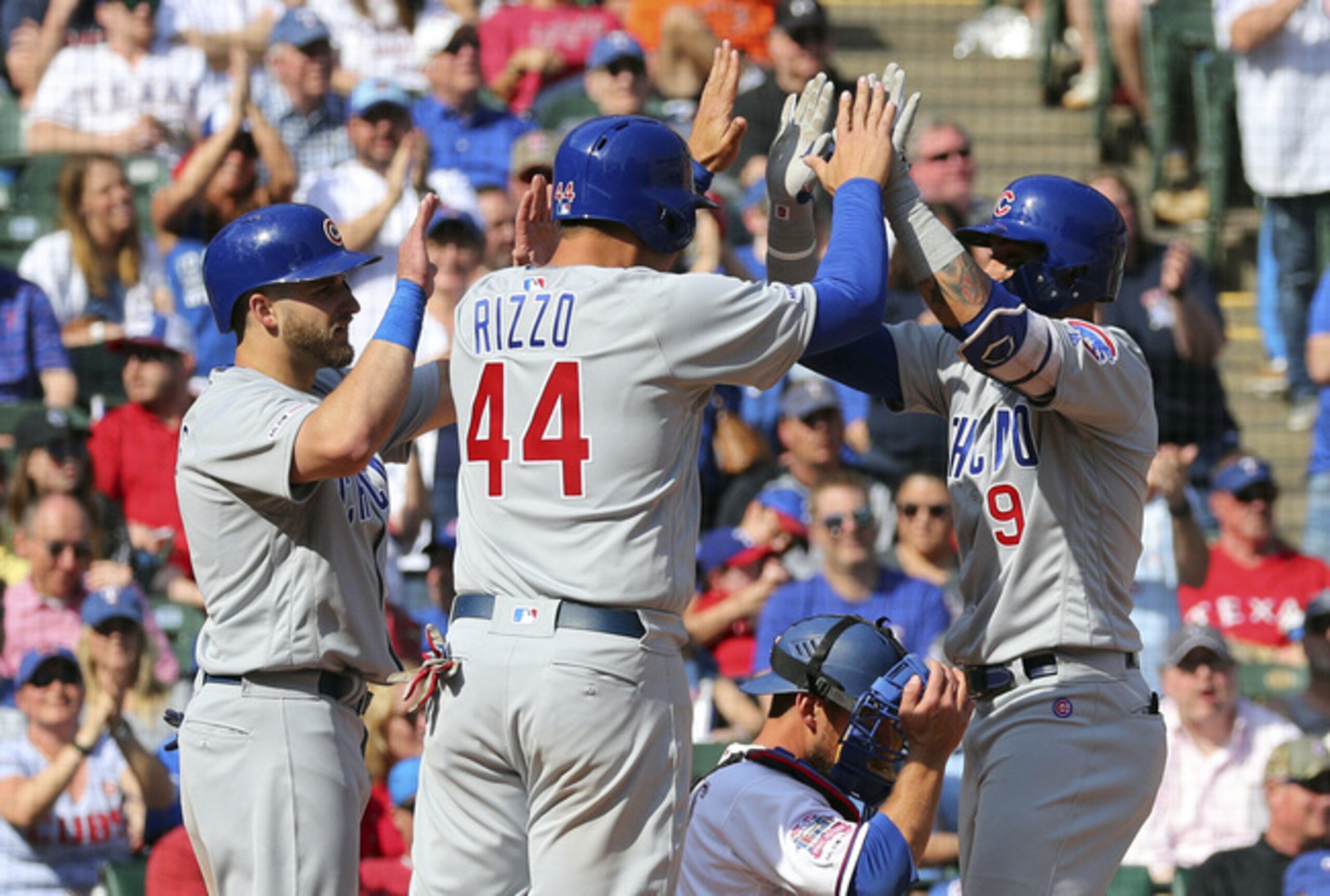 Mark Zagunis (L), Anthony Rizzo (C) and Javier Baez (R)