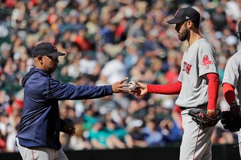 Alex Cora (L) and Rick Porcello (R)