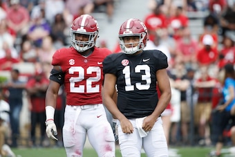 Najee Harris (22) and Tua Tagovailoa (13)